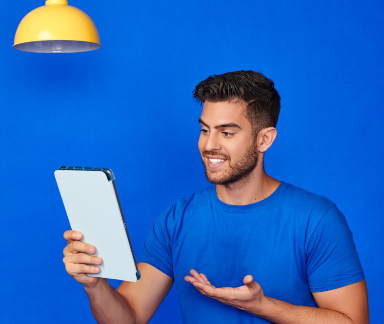 Man in a blue shirt exploring Spravato treatment options for Depression Relief on Tablet